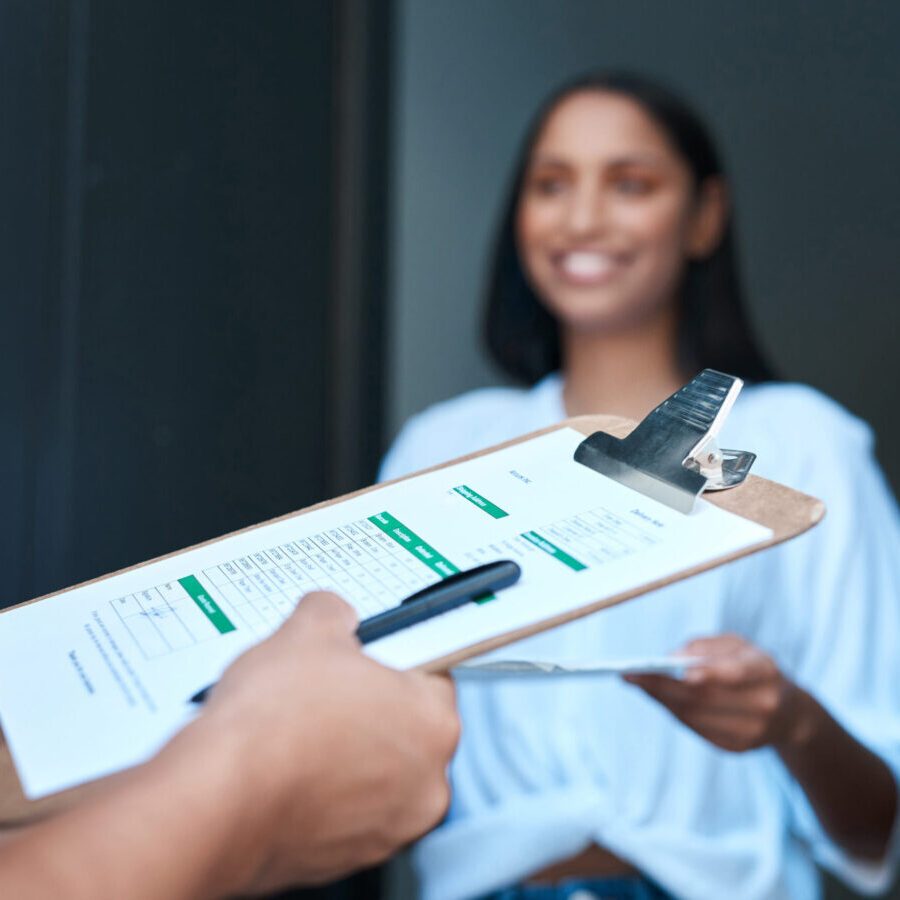 Thank you for the delivery. Shot of a young woman receiving a delivery at home